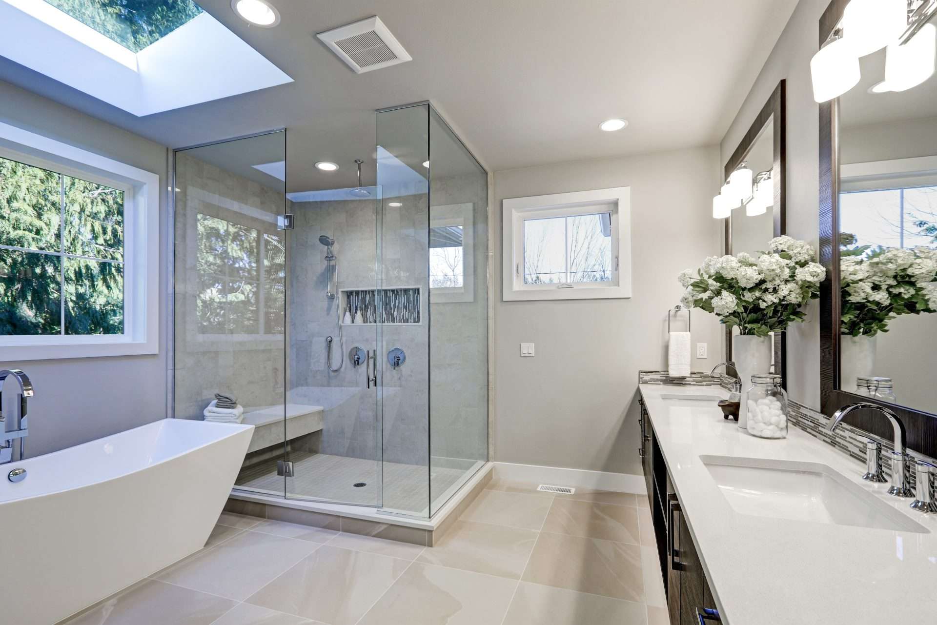 spacious bathroom in gray tones with heated floors